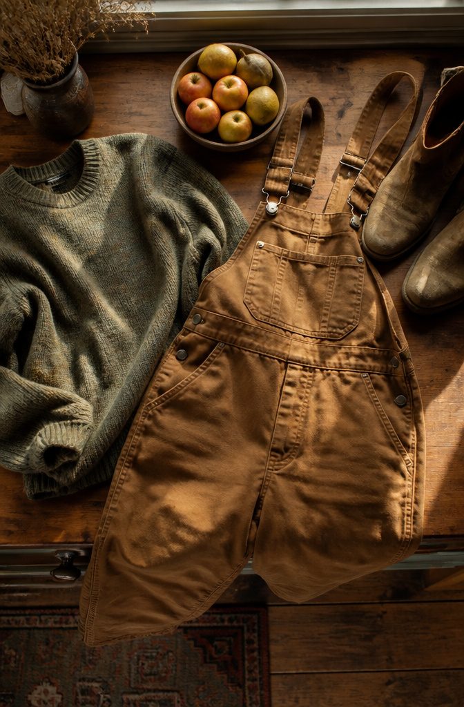 Carhartt overalls alongside natural materials like wool and leather.