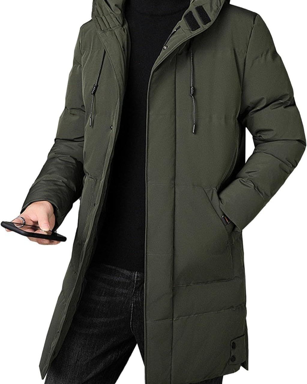 Man wearing a long olive green insulated parka with a hood and dark jeans.