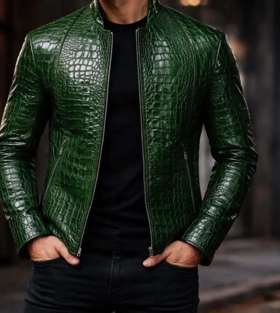 Man wearing a green crocodile leather biker jacket with a black shirt and jeans.