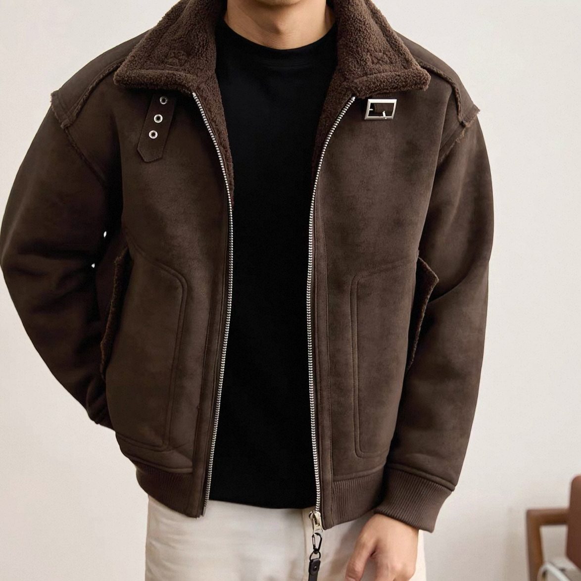 Brown suede shearling coat with wool collar worn over a black t-shirt.
