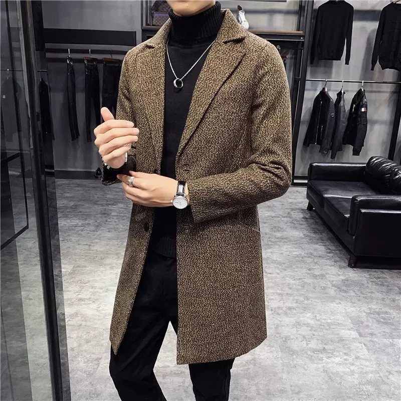 Man wearing a brown textured wool overcoat and black turtleneck in a store